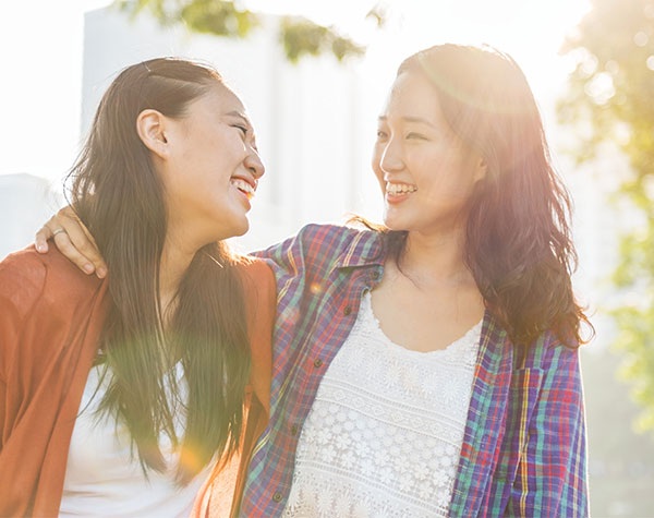 friends laughing while walking