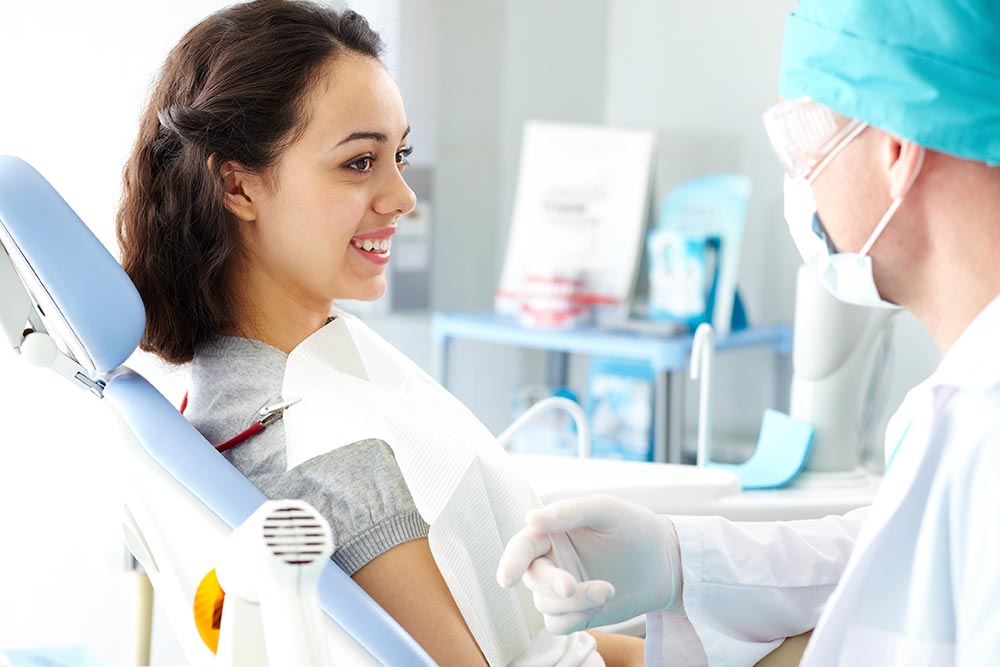 patient talking to dentist